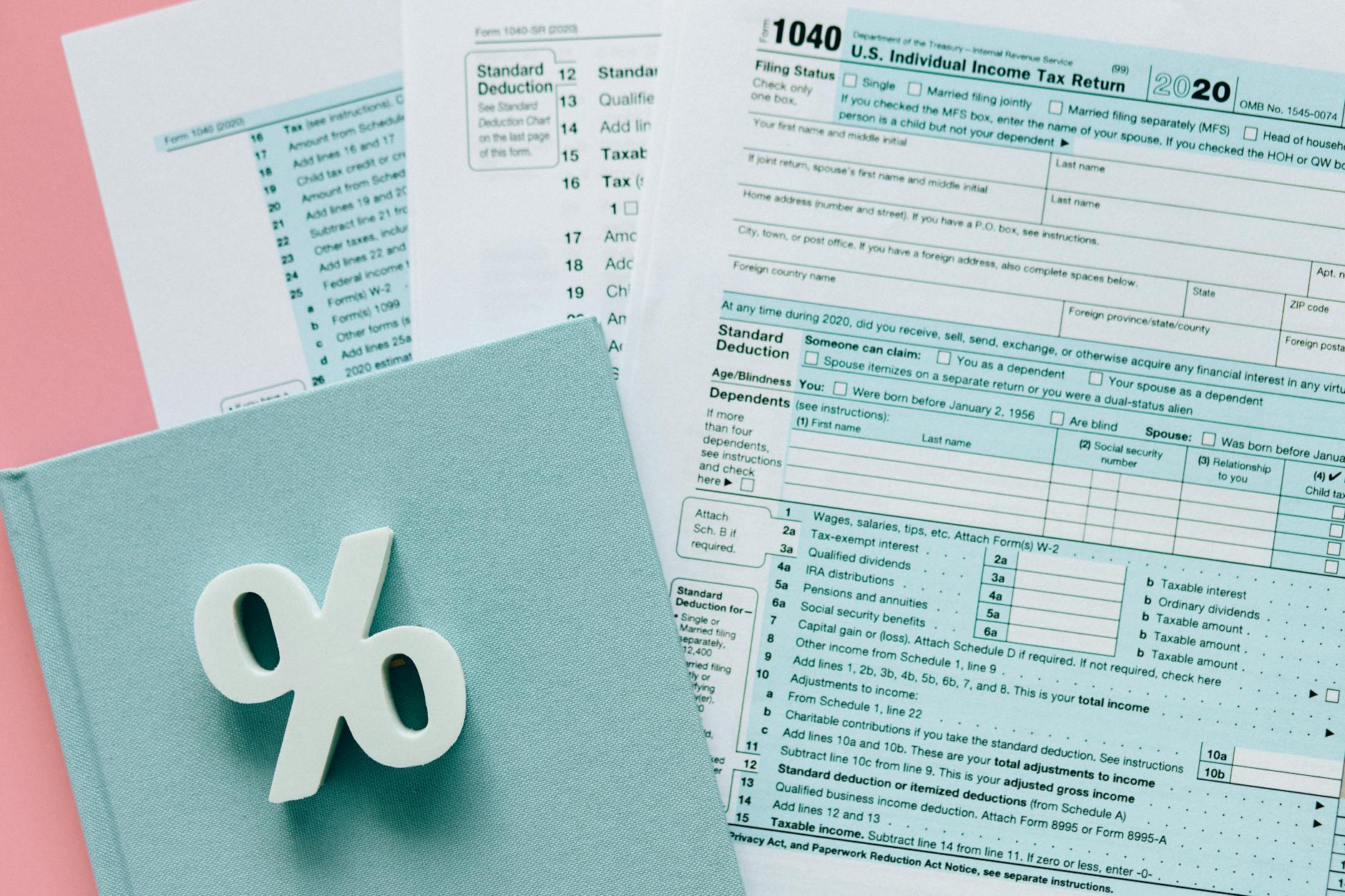 A clean editorial tax-planning scene with forms and calculation visuals